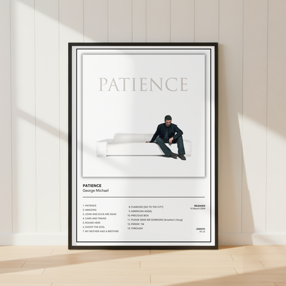 A framed minimalist music poster for George Michael's album 'Patience' leaning against a white paneled wall on a light wood floor, with soft window shadows cast across the scene.