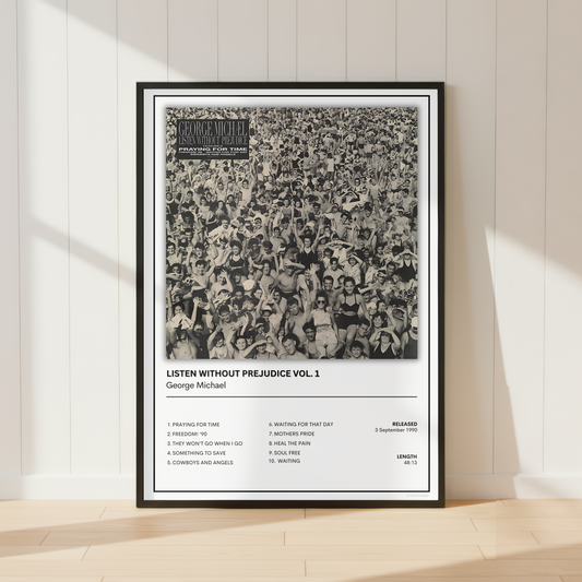 A framed black-and-white music poster for George Michael's album 'Listen Without Prejudice Vol. 1' leaning against a white paneled wall on a light wood floor, with soft sunlight casting shadows across the scene.