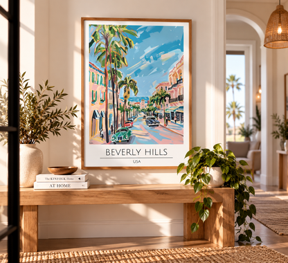 A framed art print of a colorful Beverly Hills street scene with palm trees and the text 'BEVERLY HILLS USA' at the bottom, displayed on a wooden bench in a bright, modern living room.