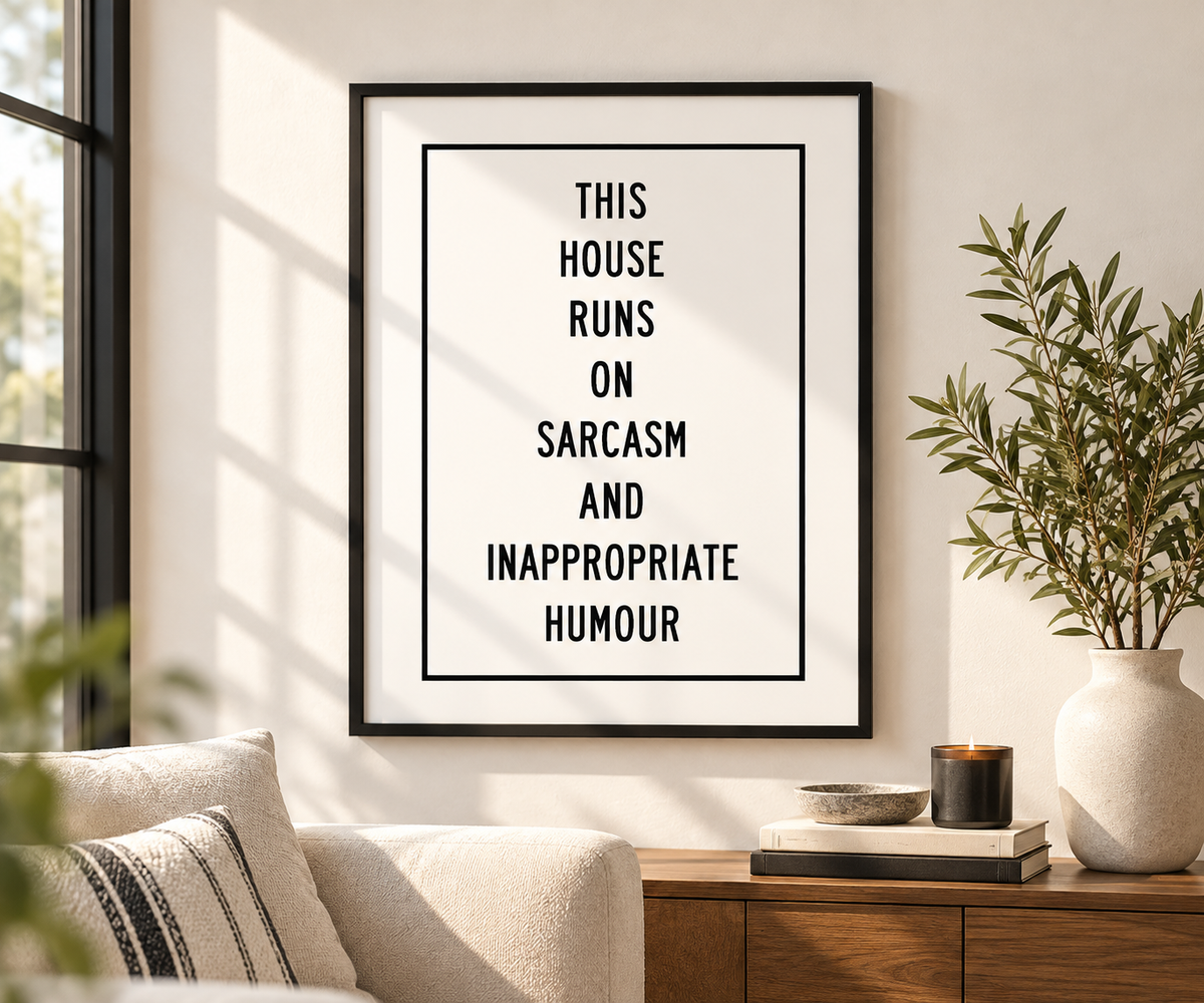 Funny this house runs on sarcasm quote print styled in a modern kitchen with black and white typography decor