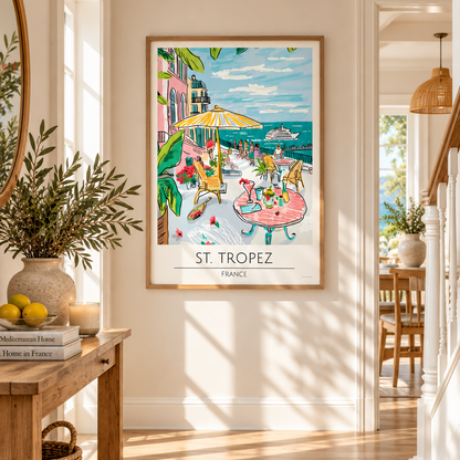 Saint Tropez France coastal travel poster displayed in a light oak frame in a stylish neutral hallway