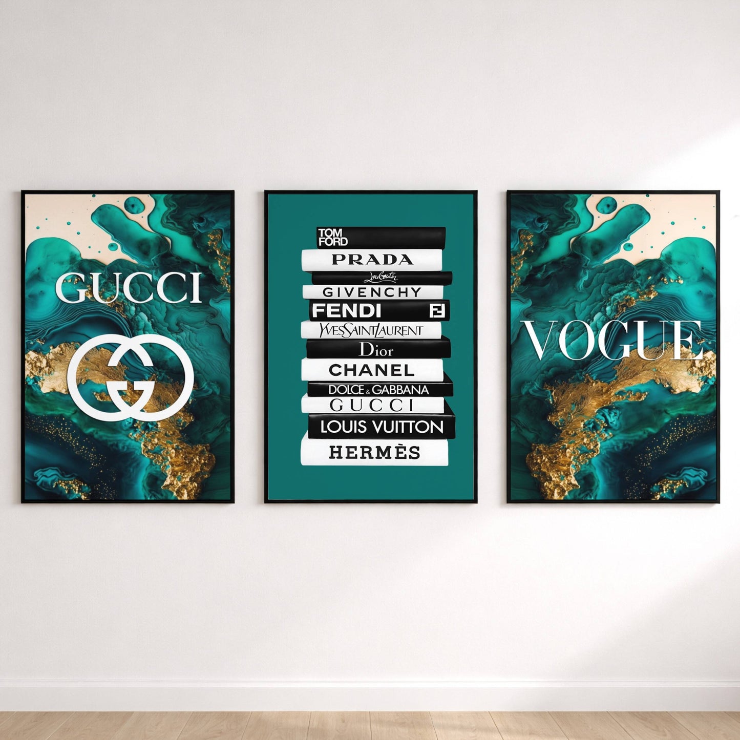Three framed artworks on a wall, featuring Gucci, Prada, Fendi, and other fashion brand logos.