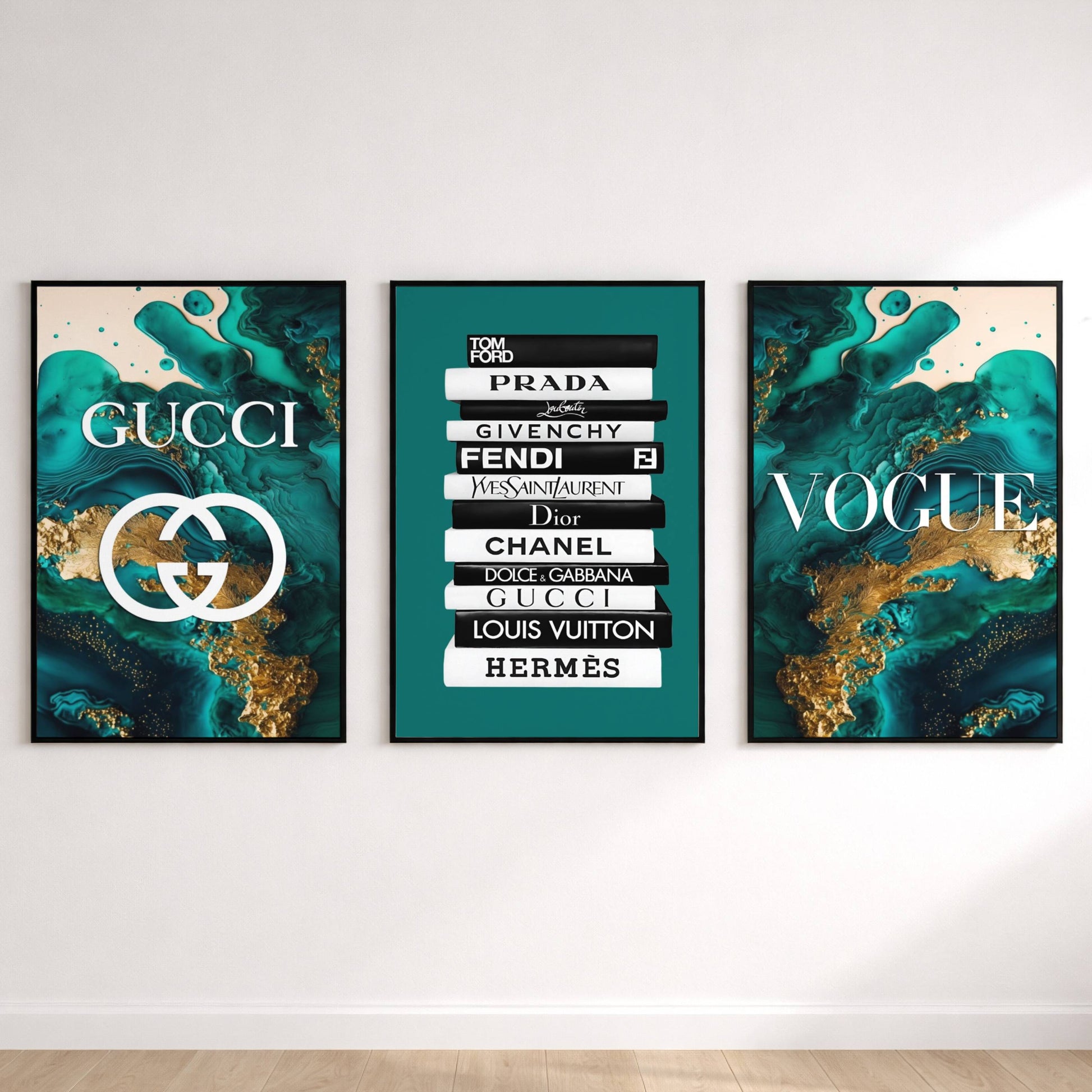 Three framed artworks on a wall, featuring Gucci, Prada, Fendi, and other fashion brand logos.