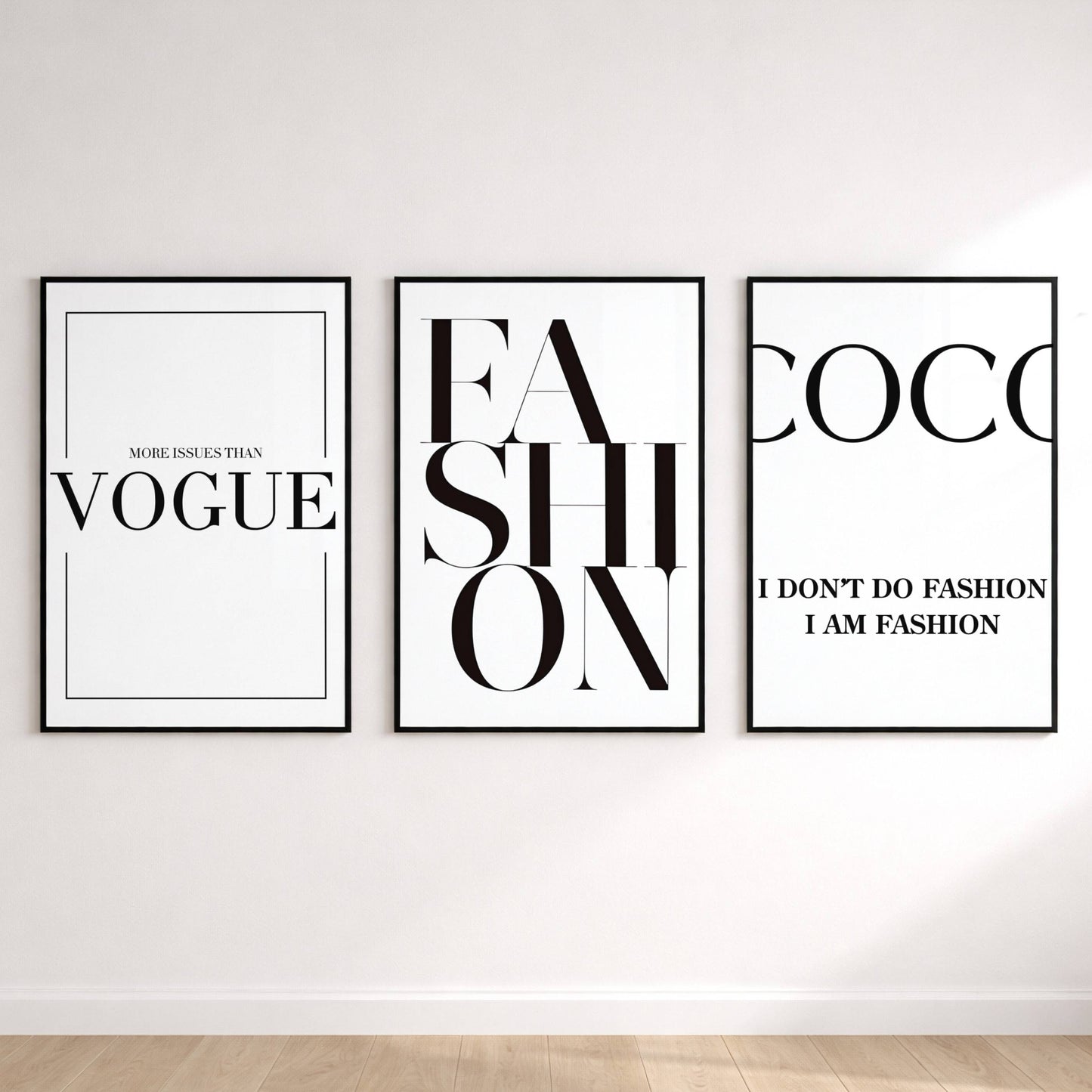 Three fashion-themed posters on a white wall.